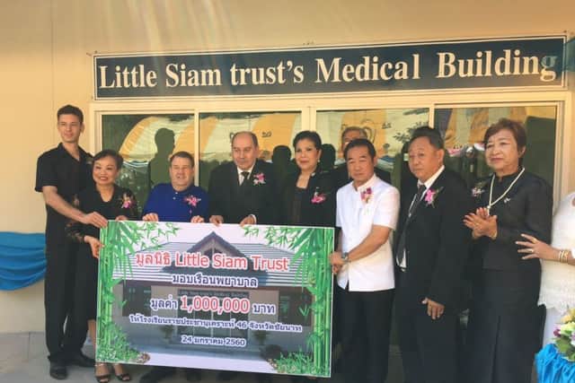Dignitaries at the opening of the new medical building funded by the Little Siam Trust. Dr Kym Khanungnit, second left, and Roger Garnett, third left. NNL-170222-092806001
