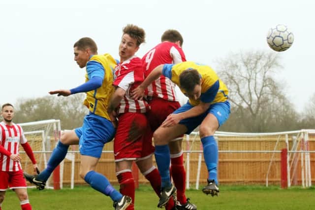 Easington Sports defender Josh Rose gets in a header against Abingdon United