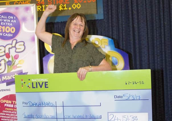 Diana Marlow, from Chipping Norton, celebrates her Â£25,000 win in bingo. NNL-170321-131636001
