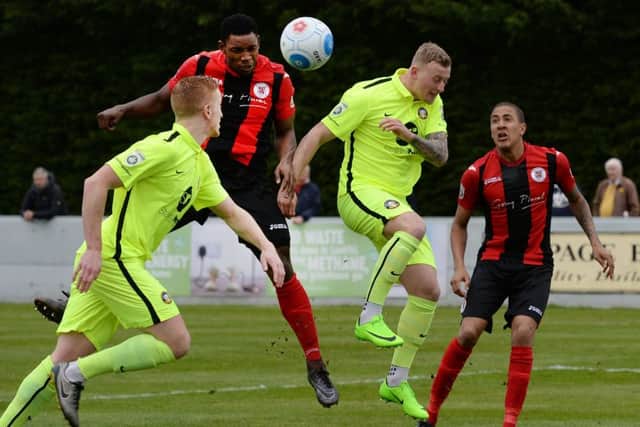 Lee Ndlovu gets in a header during Brackley Town's stalemate with Gainsborough Trinity