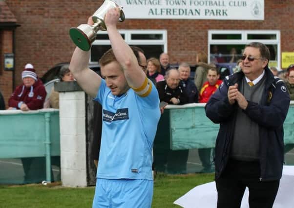 Ardley United captain Luke Cray with the trophy NNL-170105-125325002
