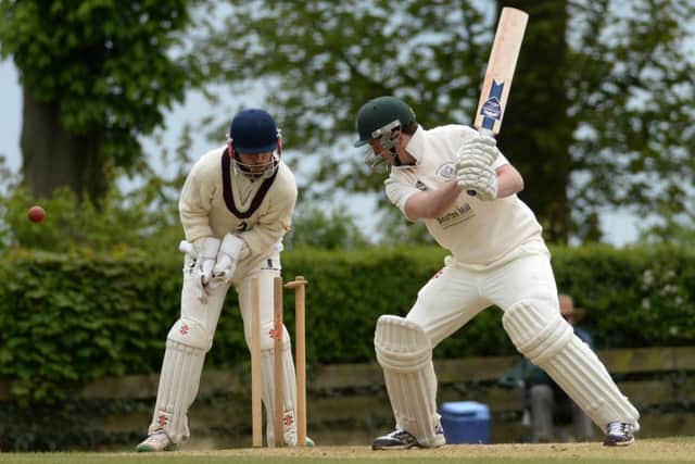 Great & Little Tew wicket keeper Robbie Catling watches on as Buckingham's Dom Pritchard is bowled by Joe Thomas