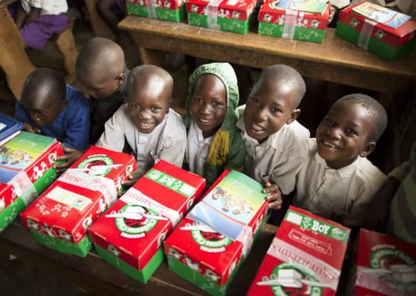 Children in Uganda receive their Christmas presents, kindly donated through the Operation Christmas Child appeal EMN-160701-102005001