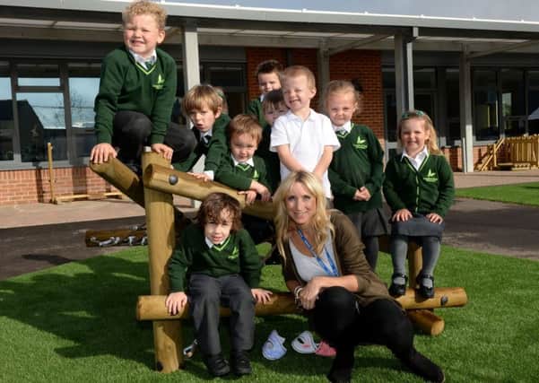 Longford Park Primary School, first few weeks of term. Zoe Spilberg, Head of Early Years with children of Badger Class, foundation age. NNL-170919-105722009