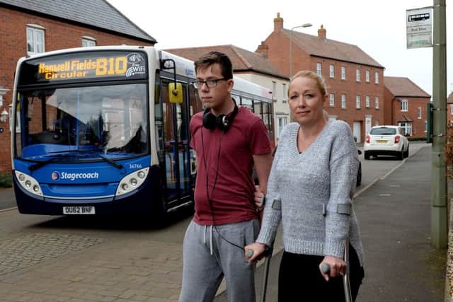 Rachel Palmer-Hearn and her son, Christopher and a Stagecoach B10 bus in Winter Gardens Way, Banbury. NNL-171017-165004009