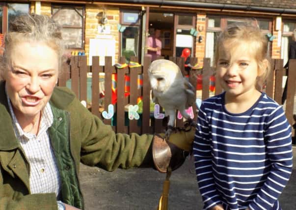 Falconer Dian from Fir Tree Falconry with four-year-old Lotty Connor from Winchcombe Farm Day Nursery?s Preschool NNL-171023-145945001
