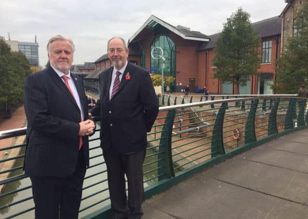 Cllrs Tony Ilott (left) and Barry Wood at Castle Quay Shopping Centre. Photo: Cherwell District Council NNL-170211-134928001