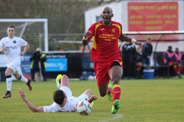 Banbury United's Jefferson Louis is thwarted against Tiverton Town