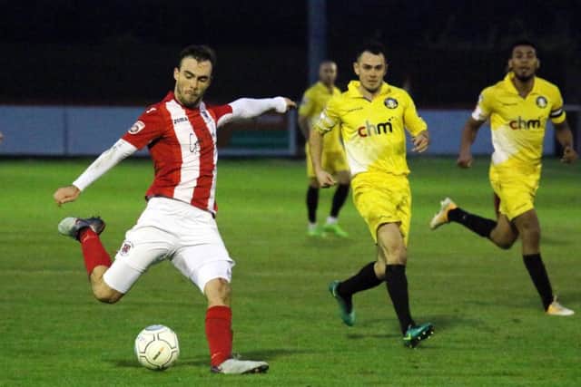Brackley Town's Shane Byrne gets in a shot against Gainsborough Trinity at St James Park