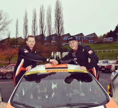 Callum Black and Elliott Edmondson celebrate their success. Photo: Welsh Rally Championship