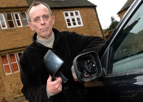 Andrew Hardcastle of Hancock's Solicitors, Banbury, with his vandalised wing mirror which will cost Â£700 to replace. NNL-171121-114000009